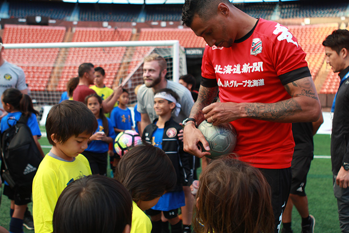 Jay Bothroyd, Soccer Player giving Autograph to Children